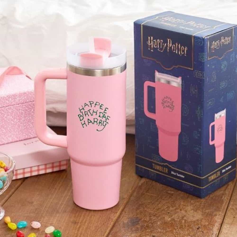 Pink Harry Potter licensed tumbler beside its retail packaging